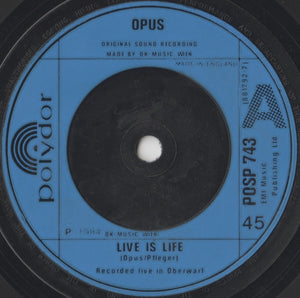 Opus : Live Is Life / Up And Down (7", Single, Blu)